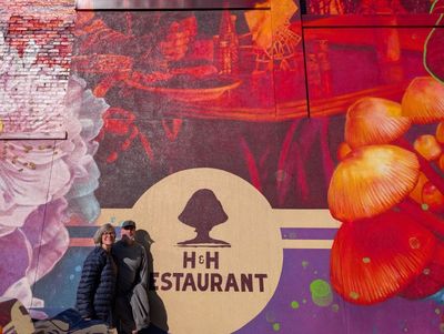 a picture of Anna and John outside the restaurant